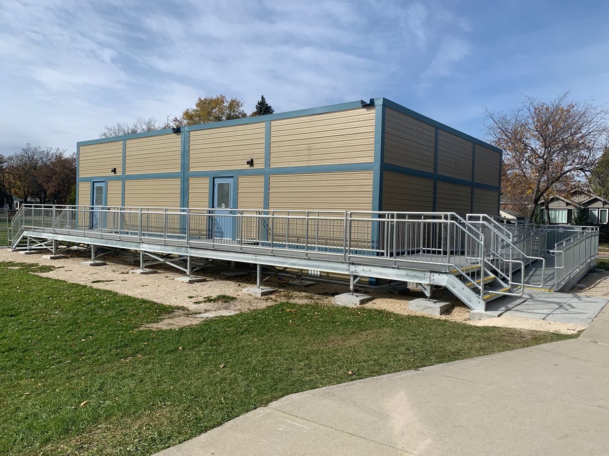 Overhead view of École Viscount Alexander School with two new modular classrooms beside the main school.