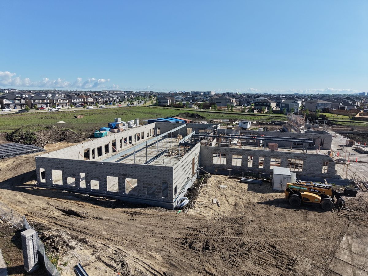 École Iskonakwa School construction site. Foundation is set and brick walls are starting to go up. 