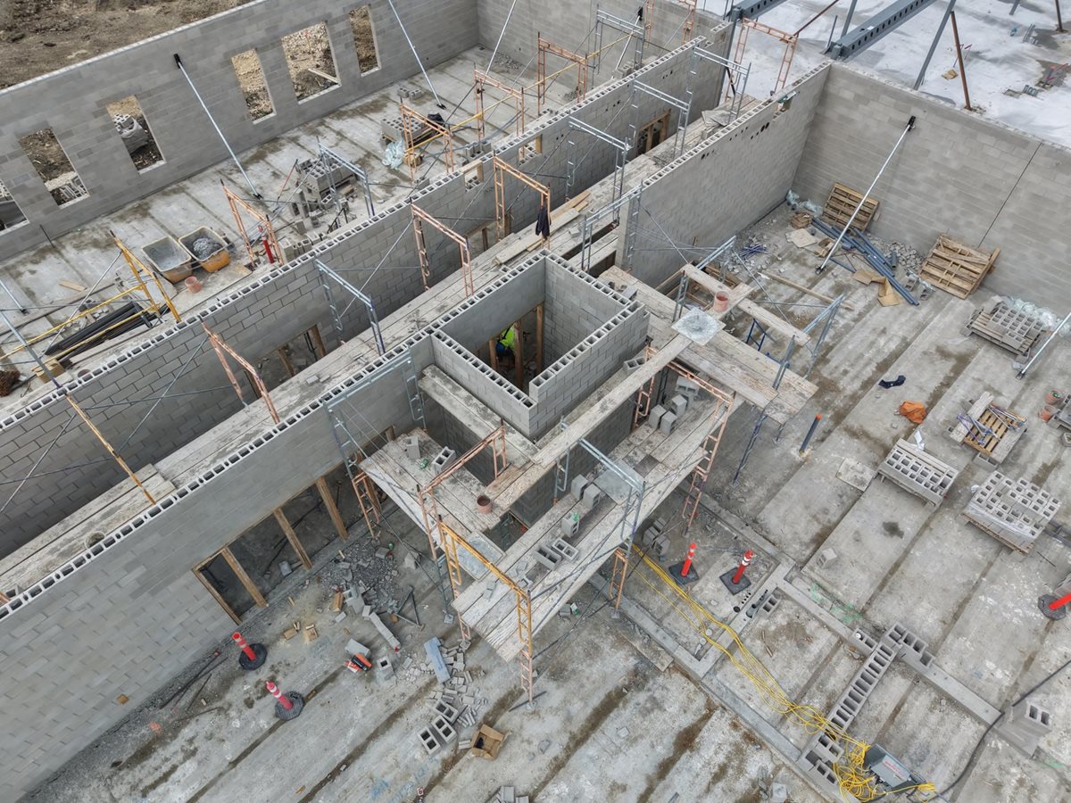 Overhead view of masonry work at École Iskonakwa School construction site.