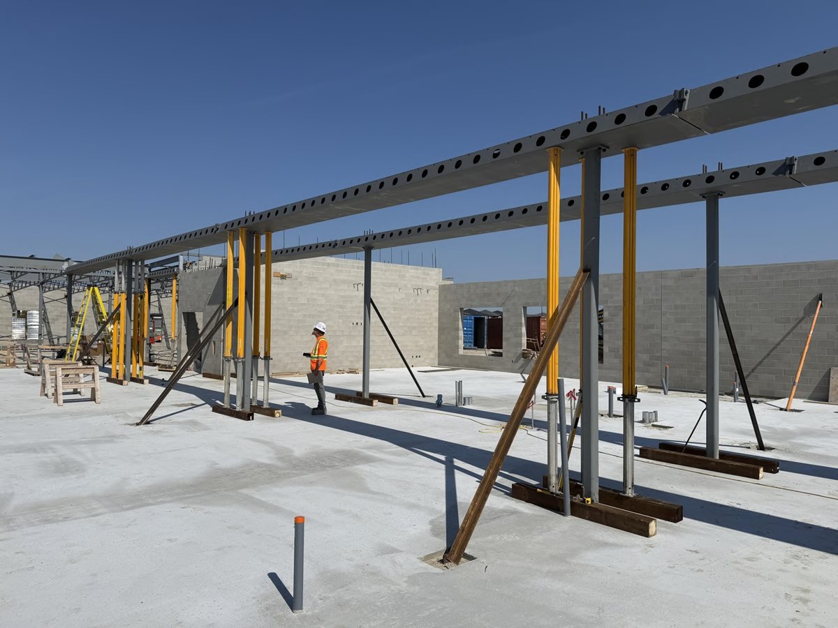 Steel work at École Iskonakwa School construction site continues with beams being put in place.