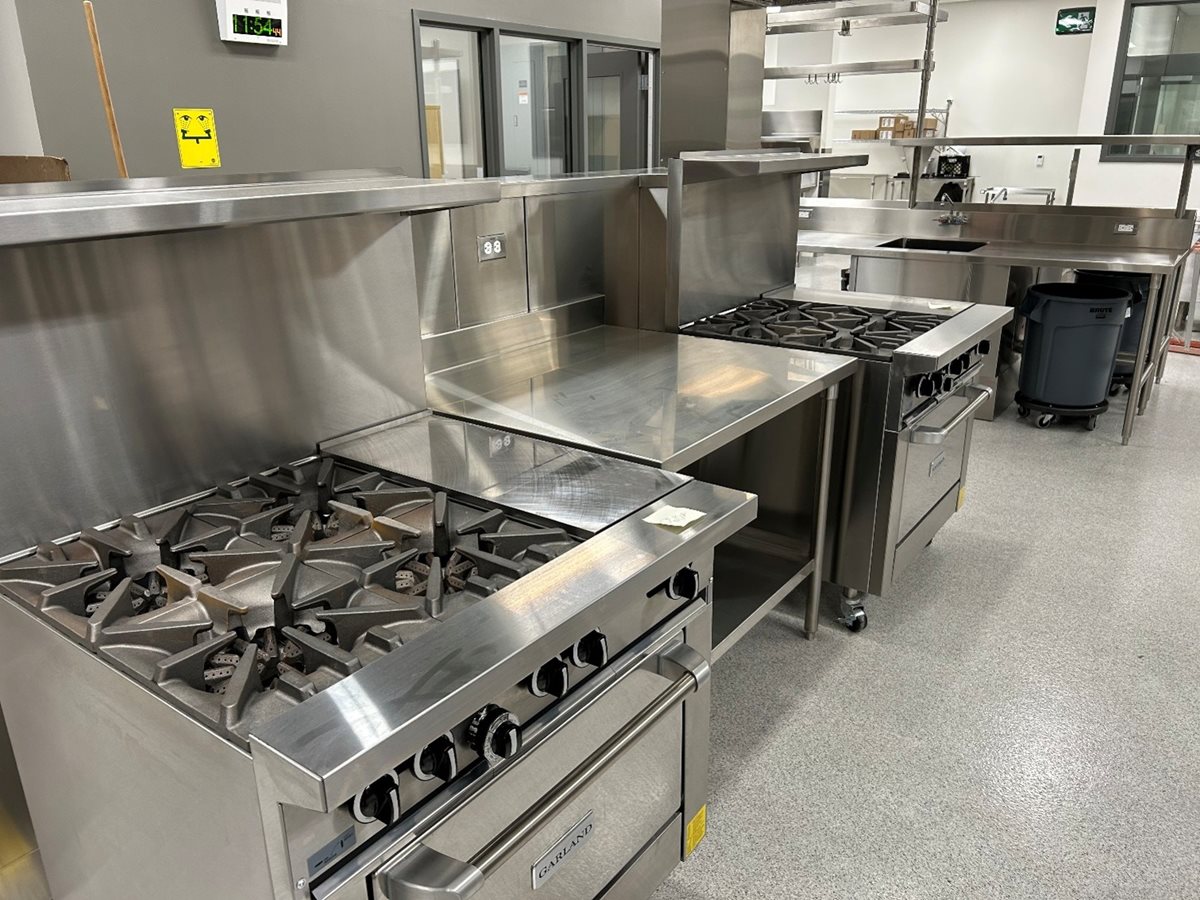 Industrial stoves and ovens in the kitchen area of the Technical Vocational Education wing that will serve the culinary and pastry arts programs